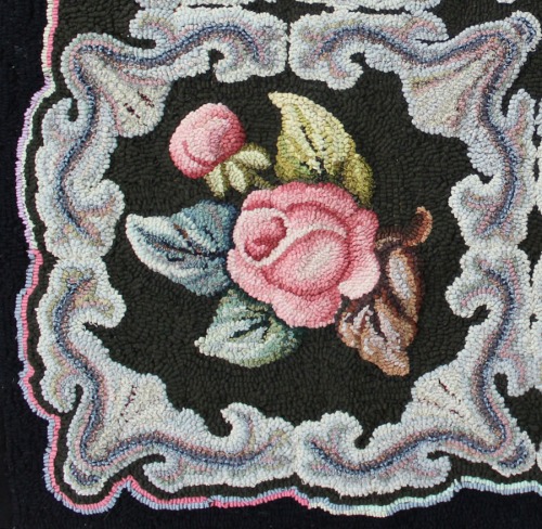 close-up of rose and scroll on Ione's mother's rug
