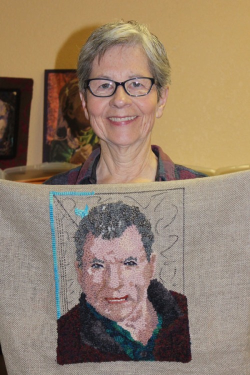Chris  and her portrait rug of her husband